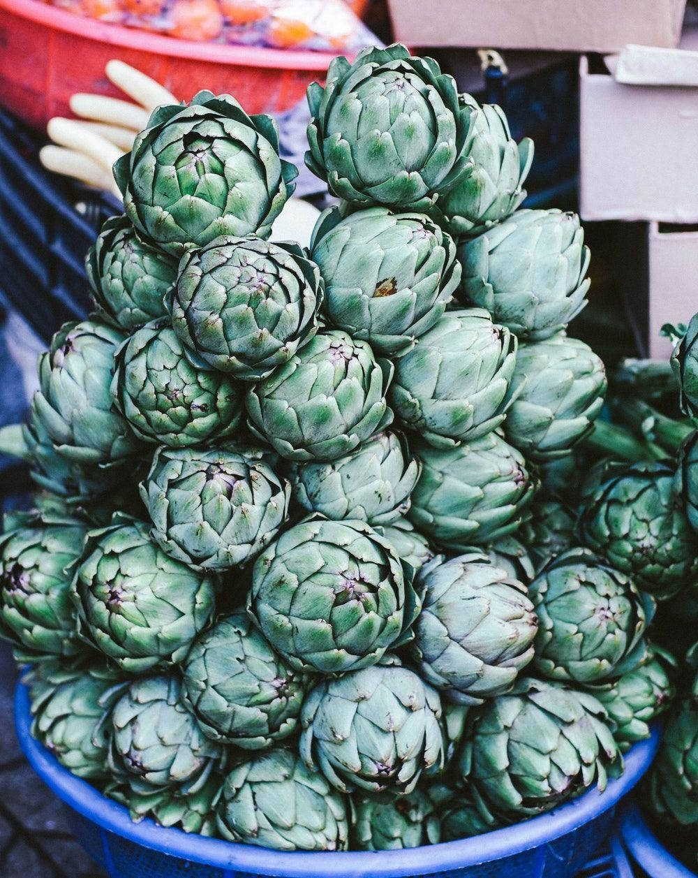 Piles Of Green Artichoke Vegetables Background