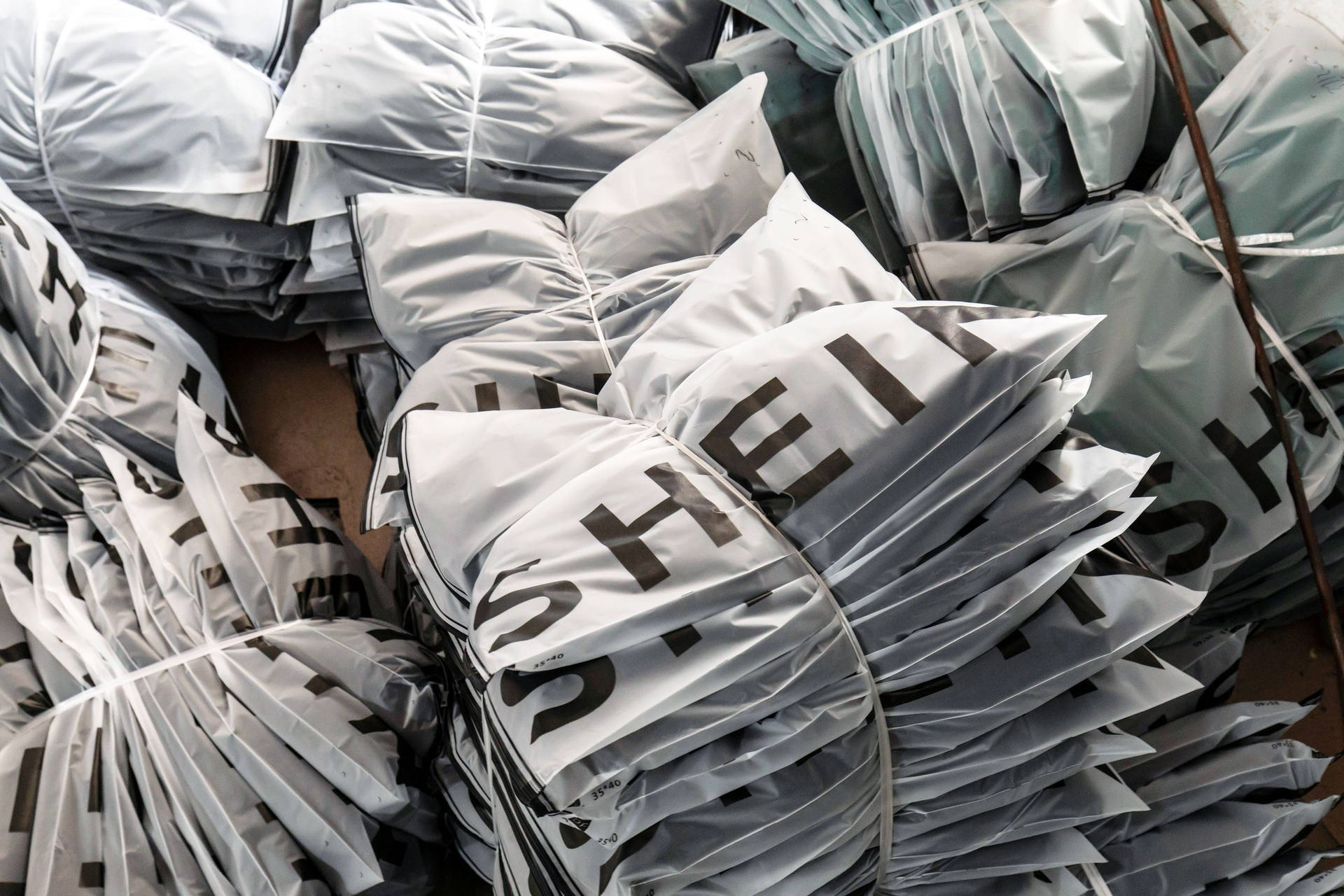 Piles Of Shein Plastic Bags Background