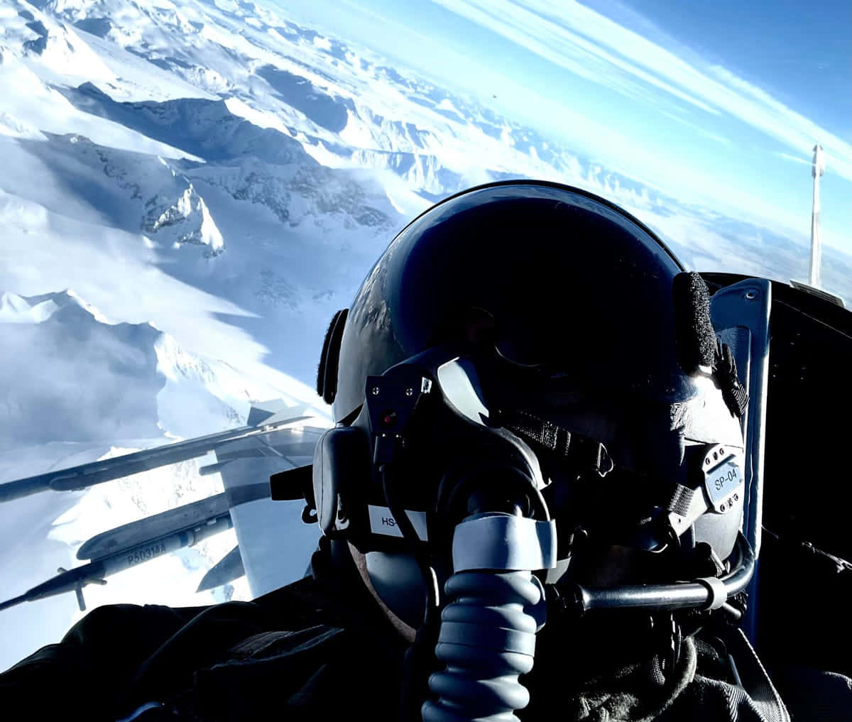 Pilot Over Snowy Mountains Background