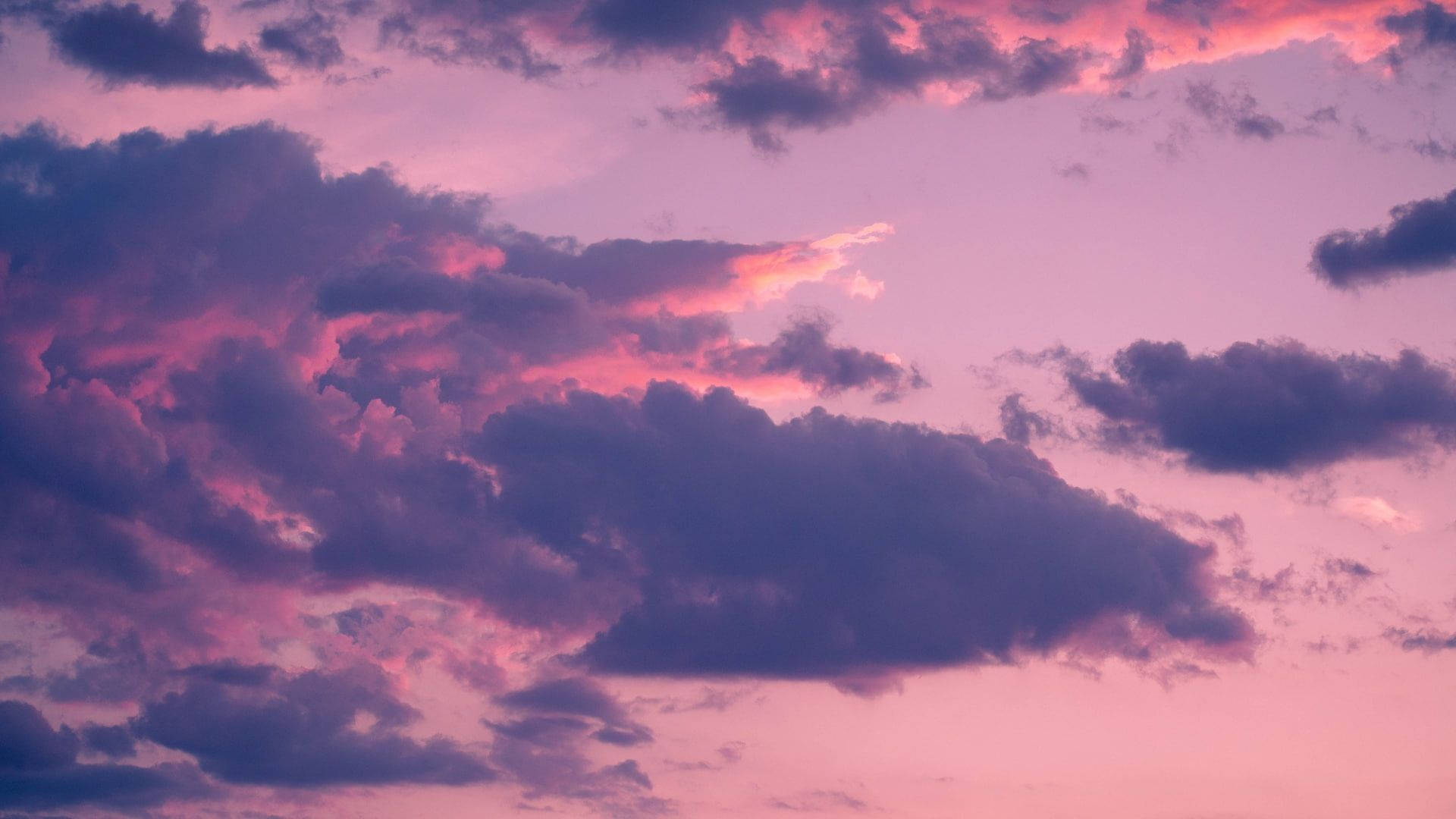 Pink And Blue Sunset Clouds Background