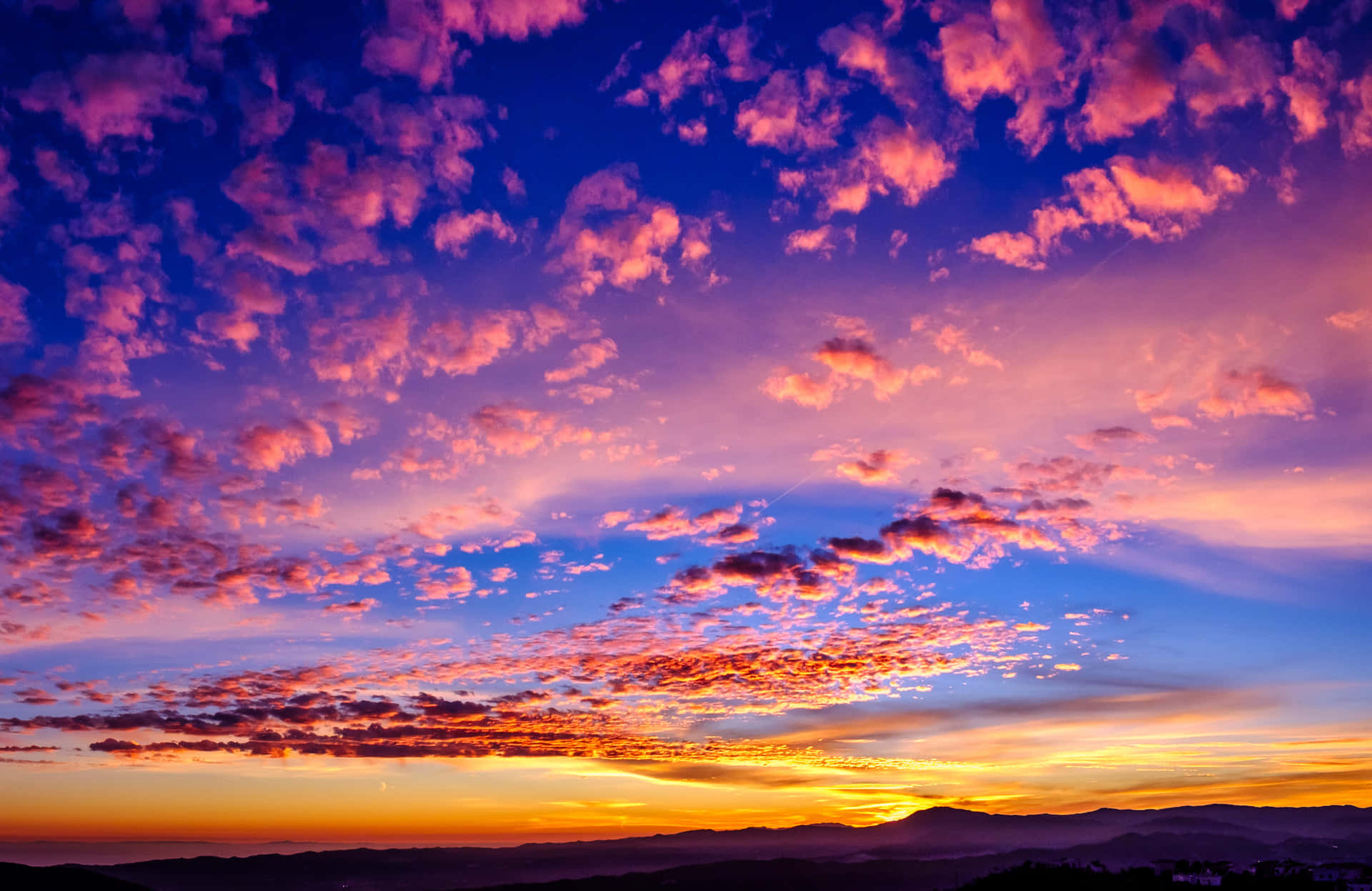 Pink And Blue Sunset Clouds Background