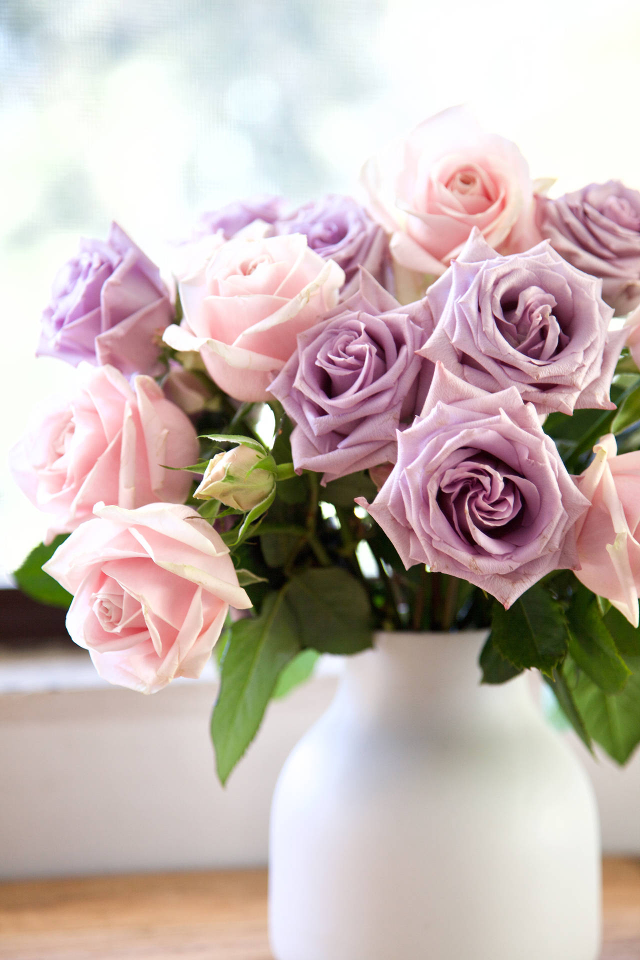 Pink And Purple Roses In White Vase Background