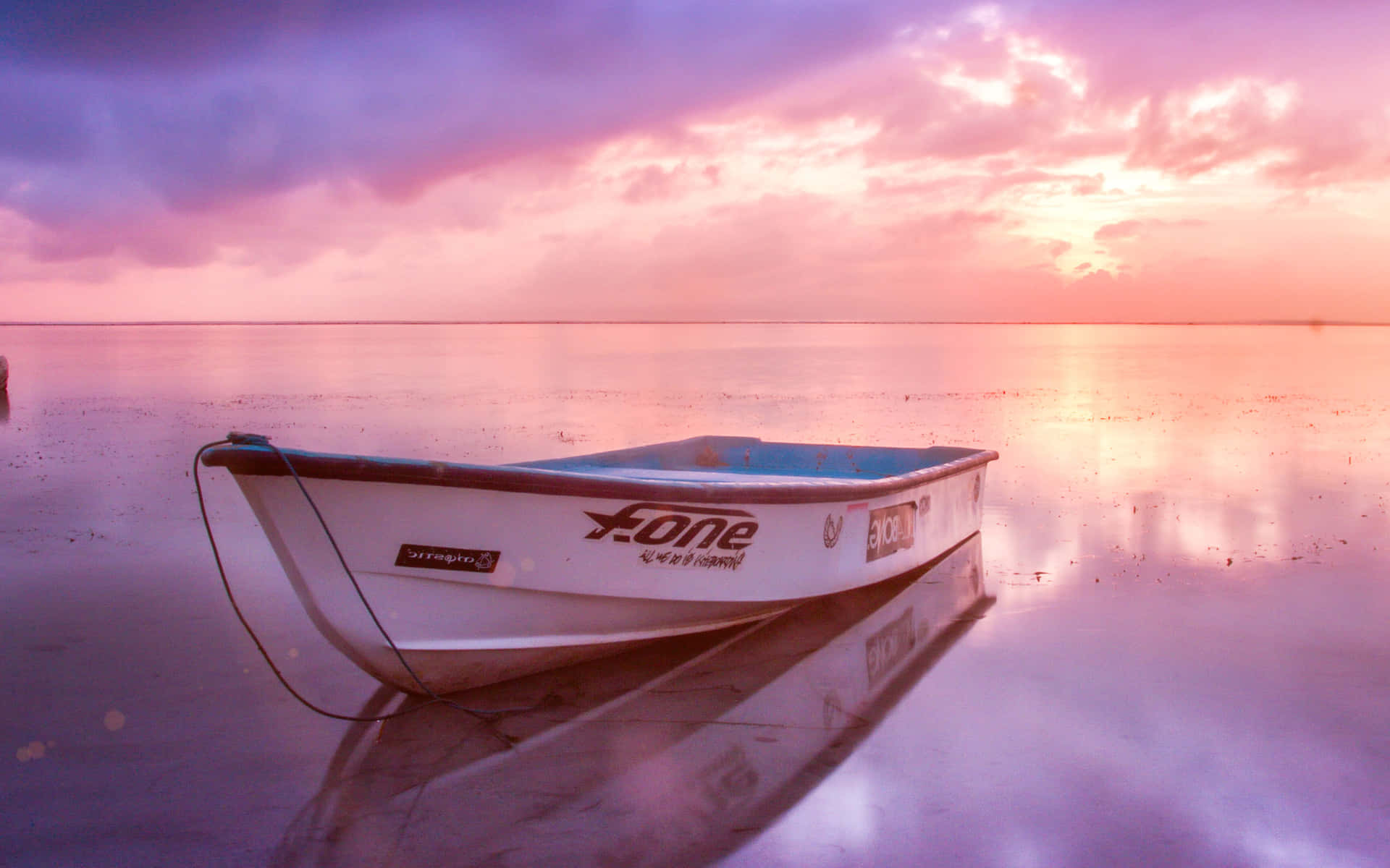 Pink Beach Sunset With A White Boat Background