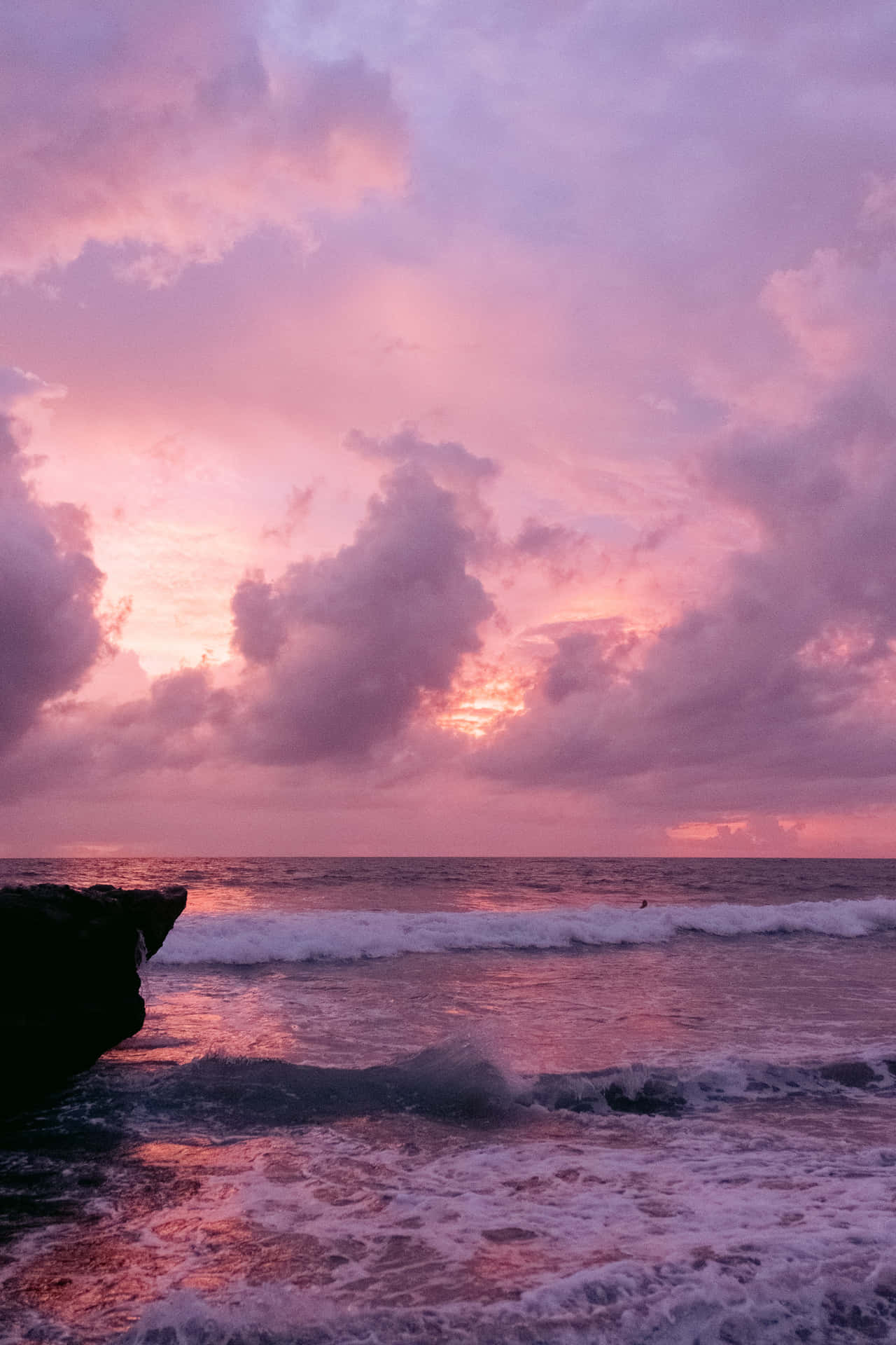 Pink Beach Sunset With Heavy Waves Background