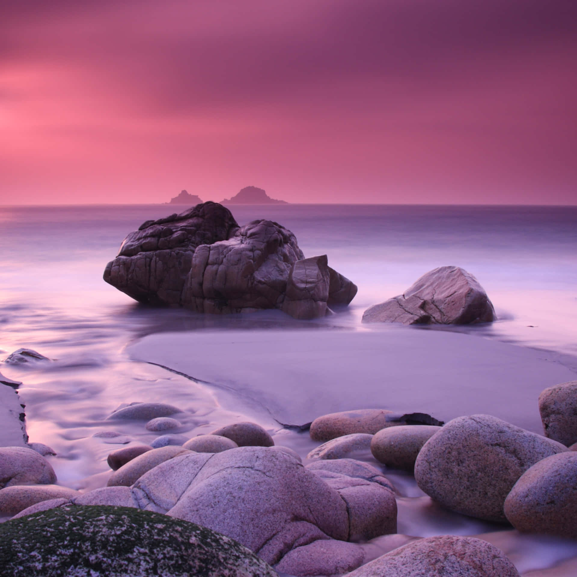 Pink Beach Sunset With Rocks Background