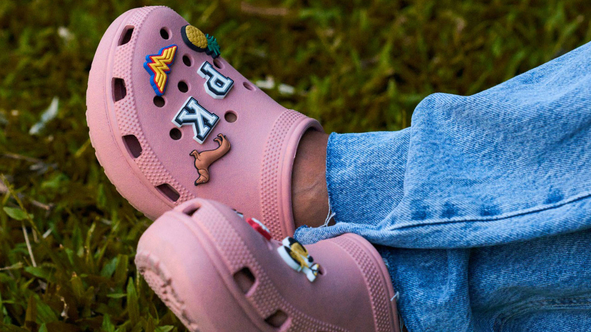 Pink Crocs Footwear With Jibbitz Background
