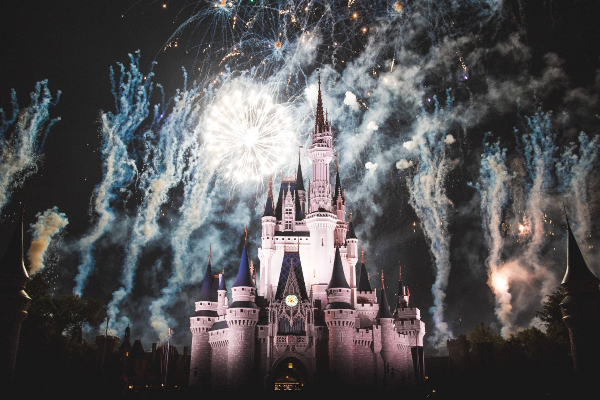 Pink Disneyland Castle And Fireworks Background