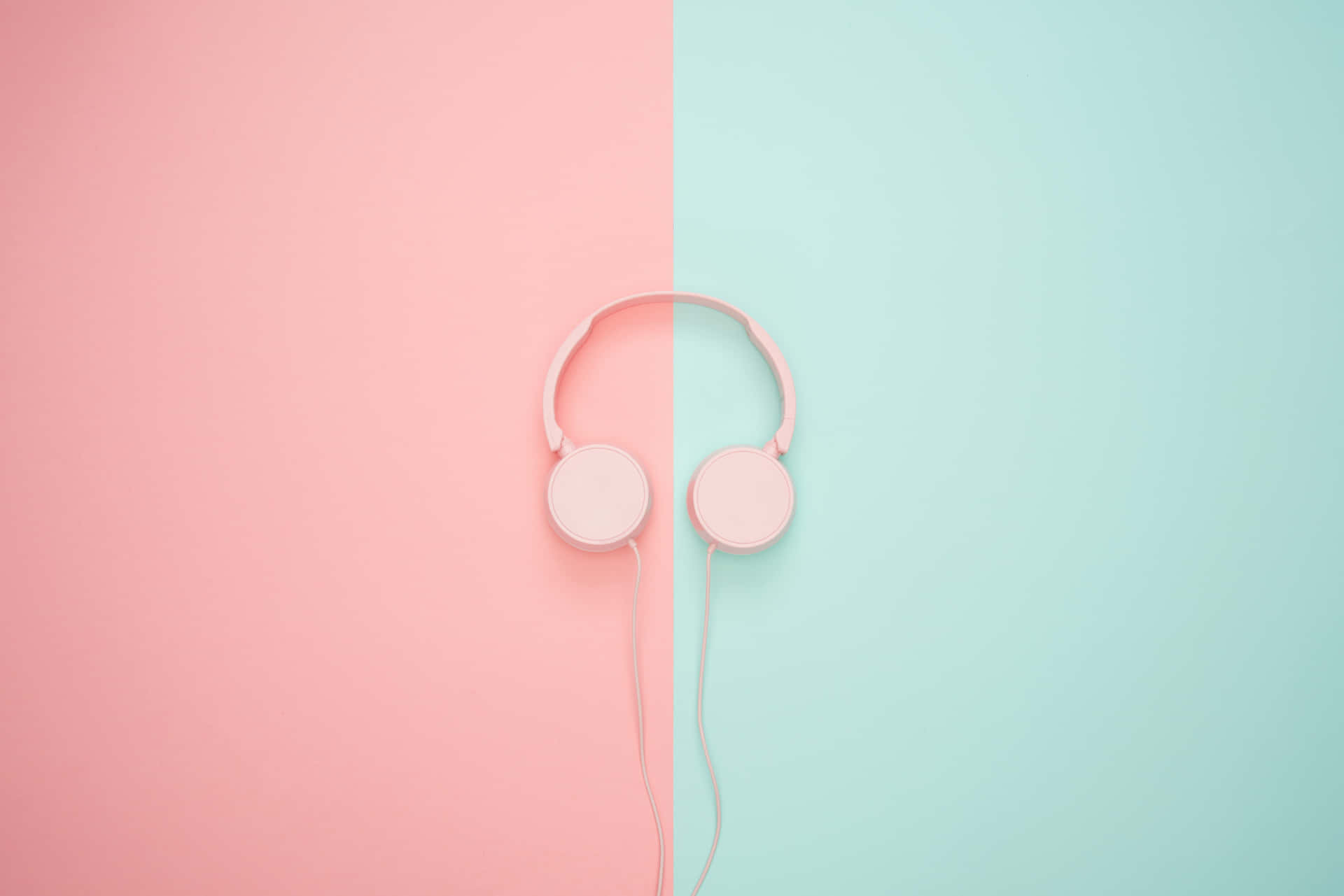 Pink Headphones On A Pink And Blue Background