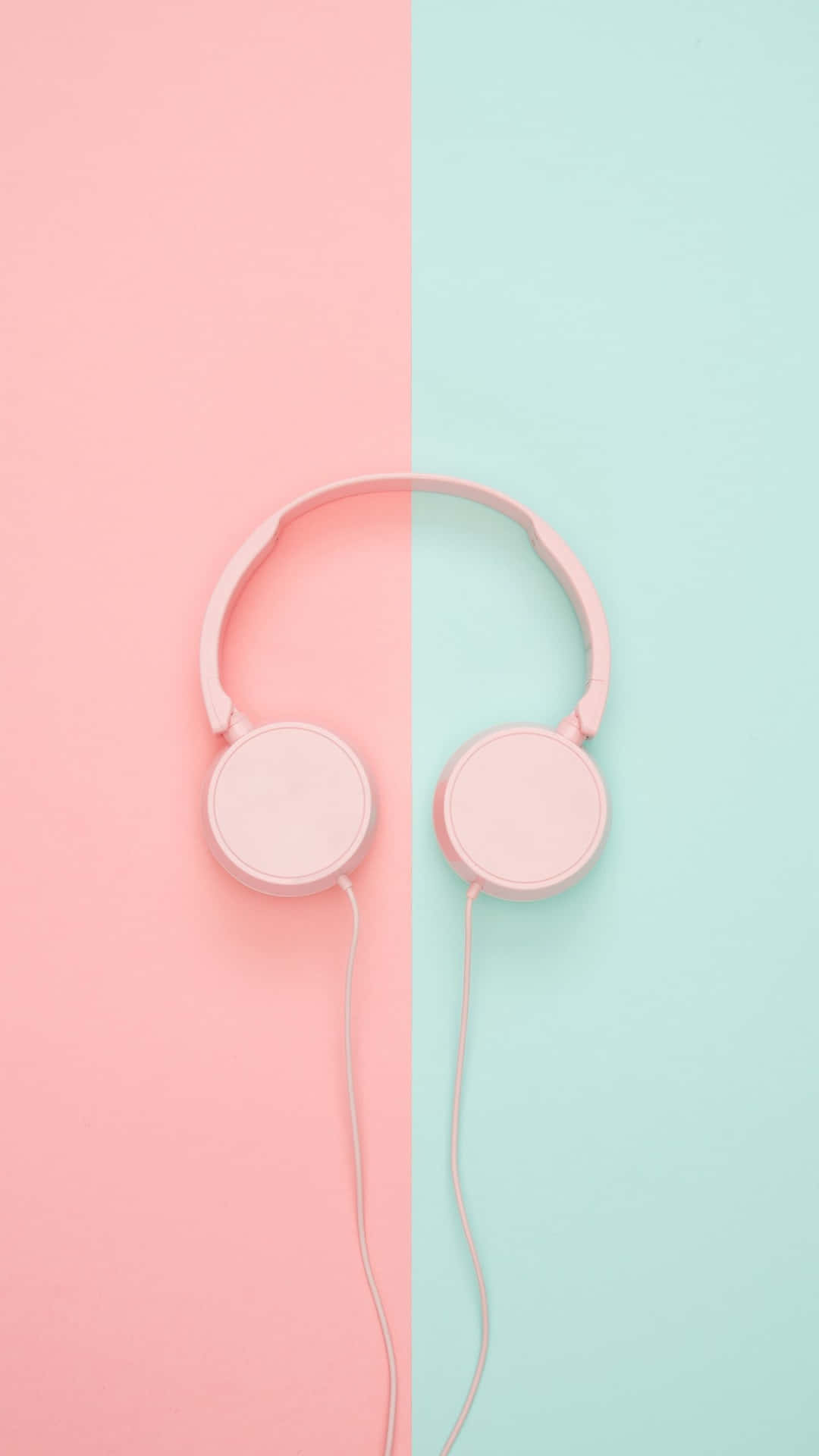 Pink Headphones On A Pink And Blue Background Background