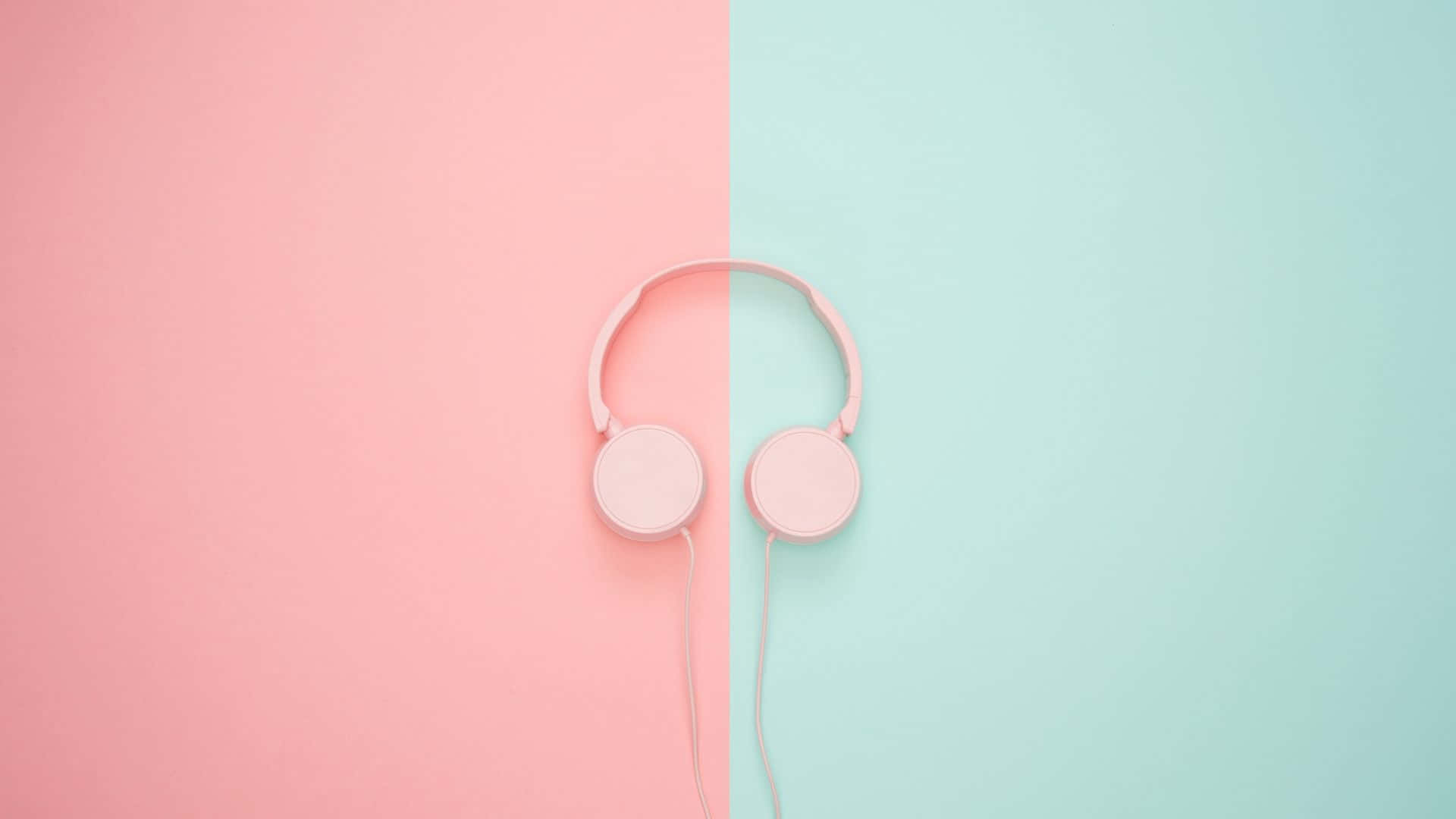 Pink Headphones On A Pink And Blue Background Background