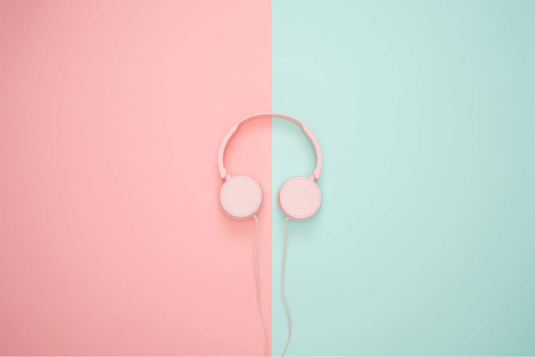 Pink Headphones On A Pink And Blue Background Background