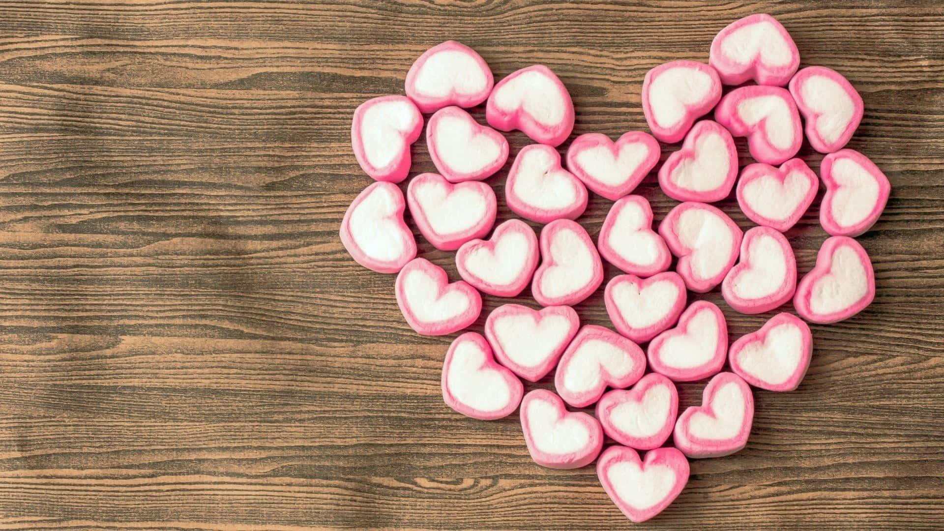 Pink Heart Candies Wooden Background.jpg Background