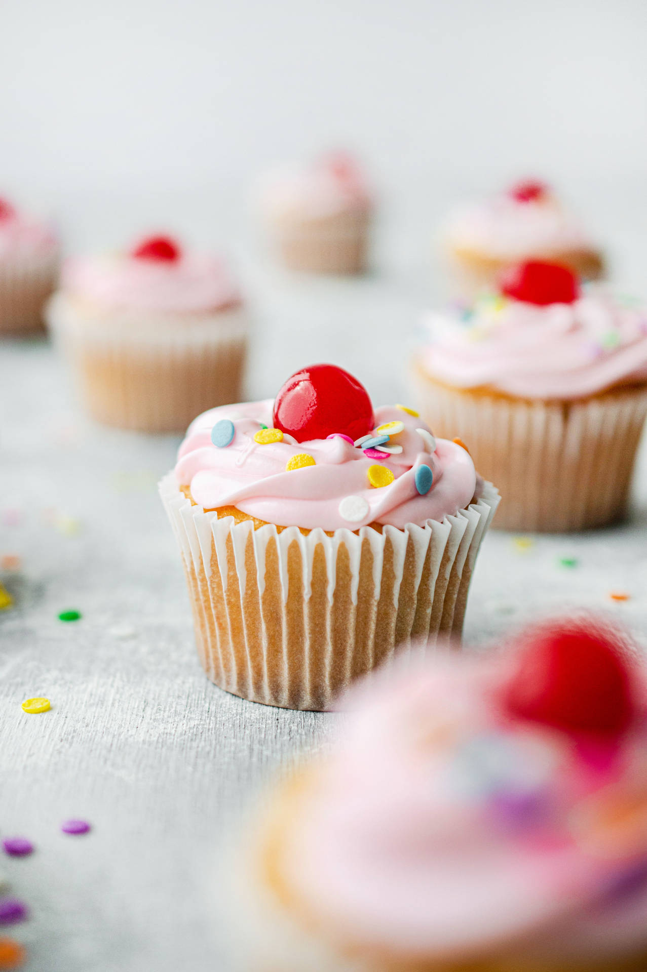 Pink Icing With Cherry Cupcake Background