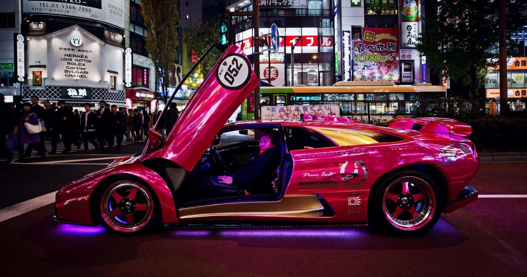 Pink Lamborghini Urban Nightlife Background