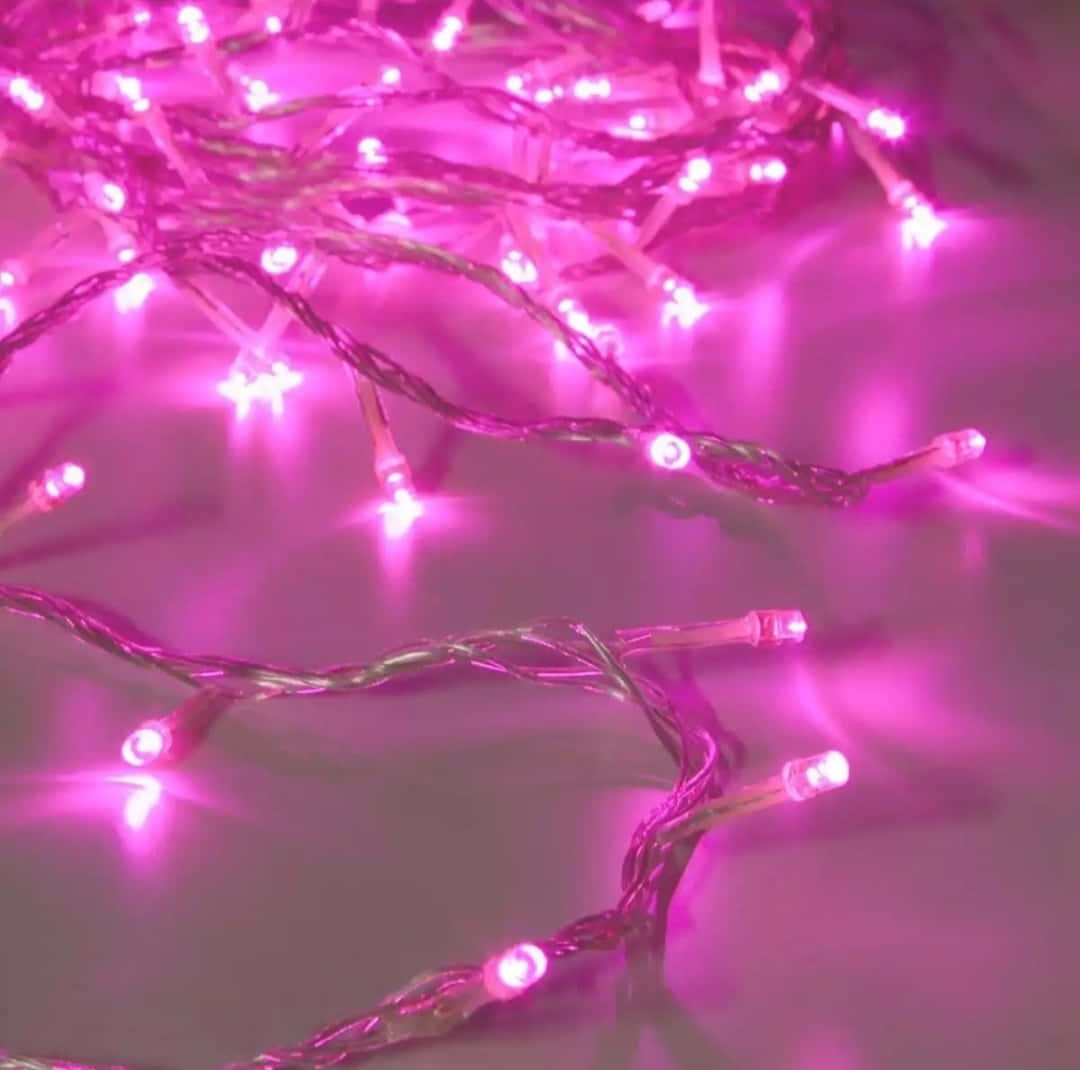 Pink Led String Lights On A Table Background
