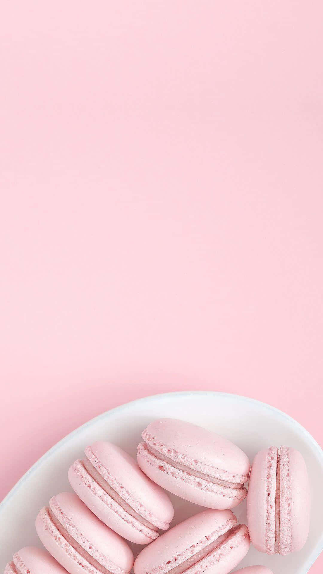 Pink Macarons On A Plate On A Pink Background Background