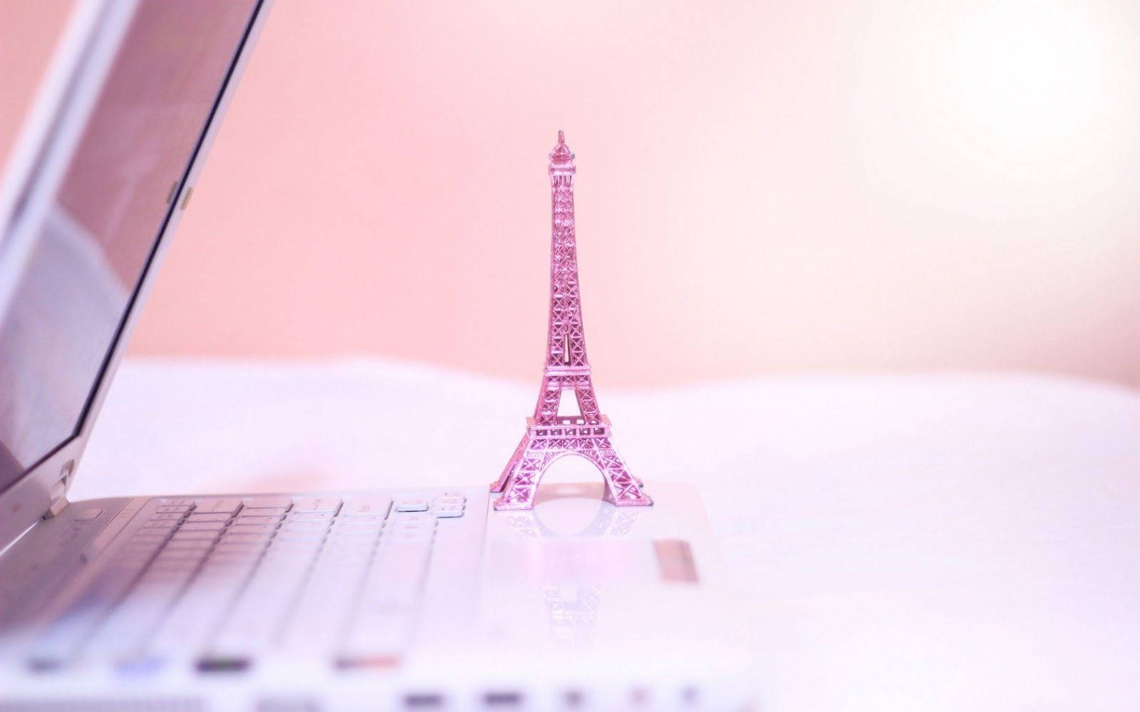 Pink Paris Tower Next To Laptop Background