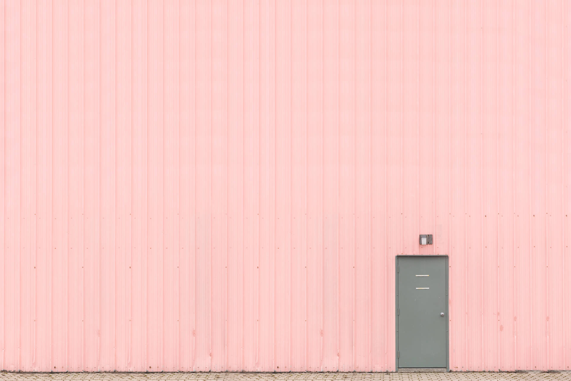 Pink Wall With Small Gray Door Background