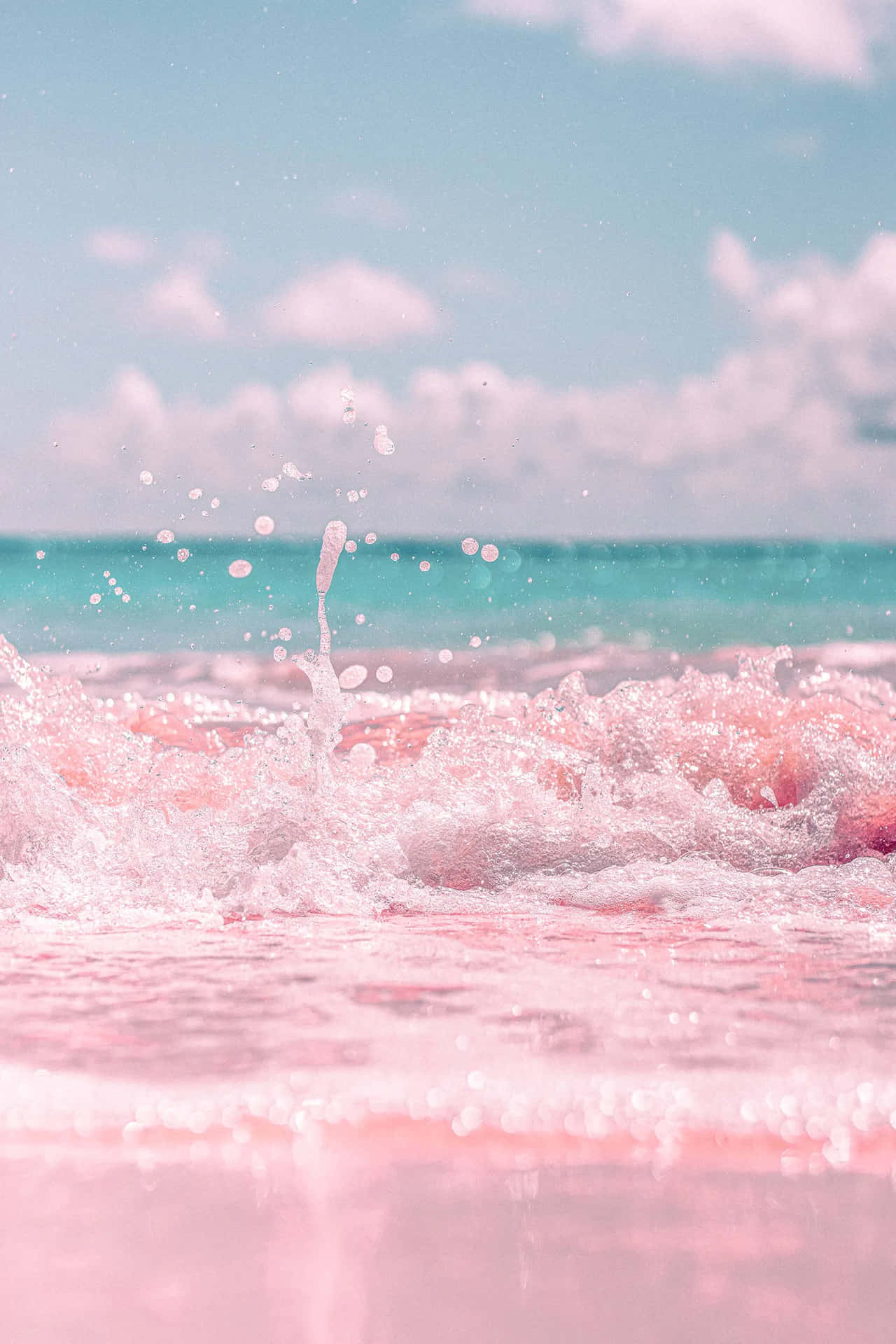 Pink Water Splashing On The Beach Background