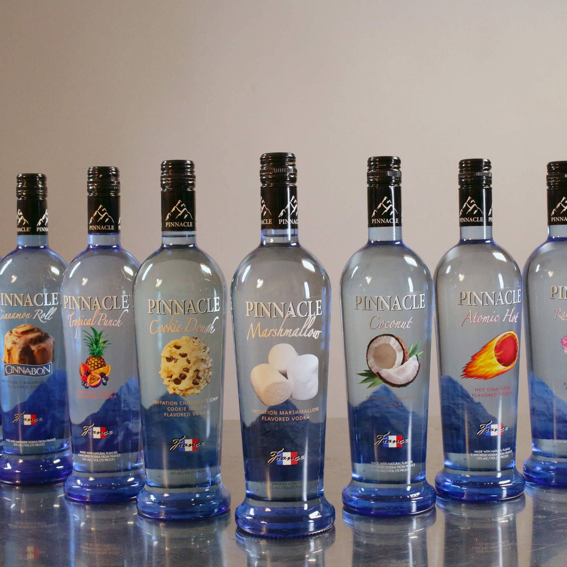 Pinnacle Vodka Different Flavored Bottles Background