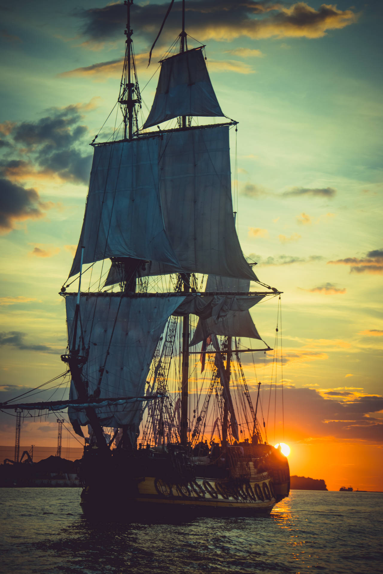 Pirate Ship At Sunset Background