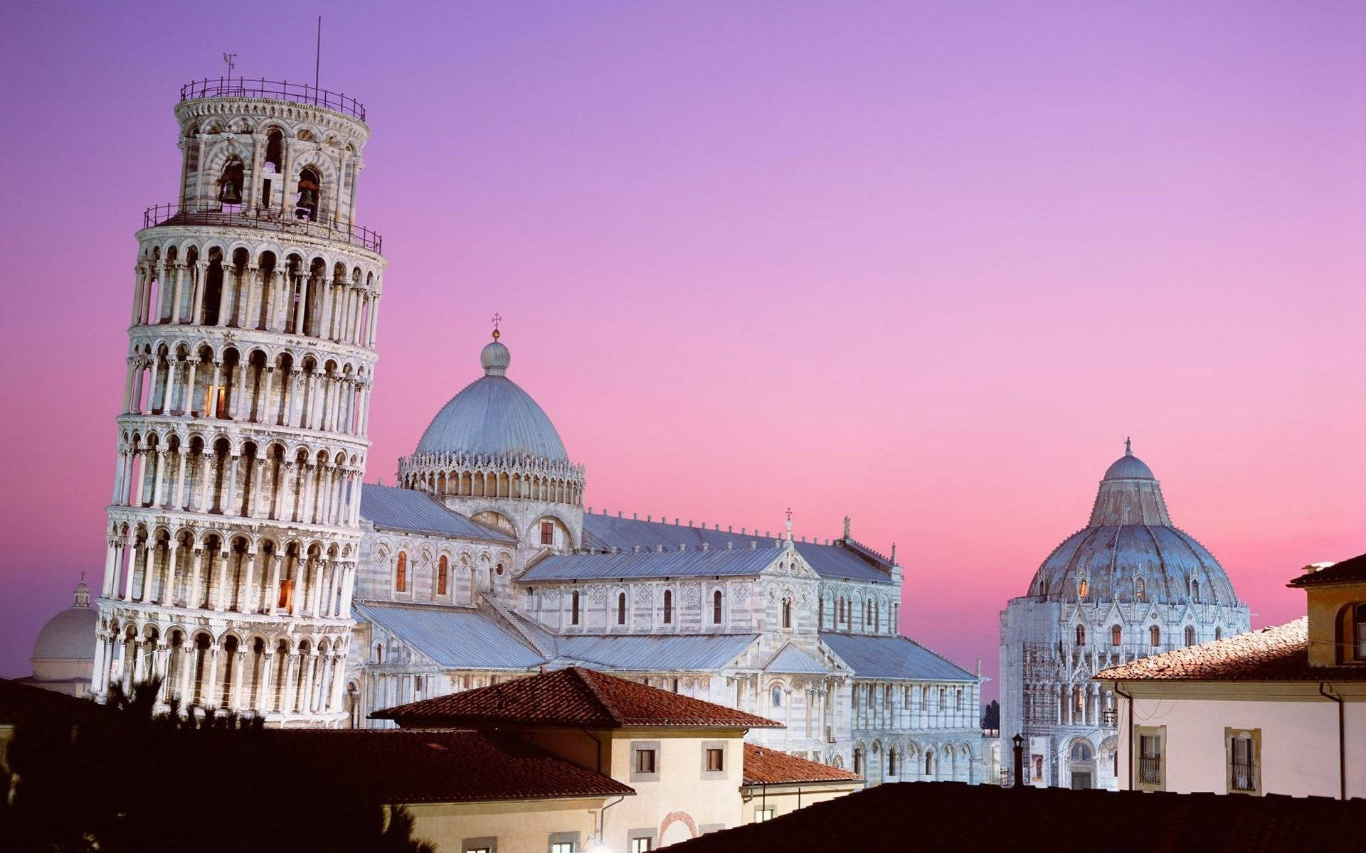 Pisa Tower Over Rooftops Background