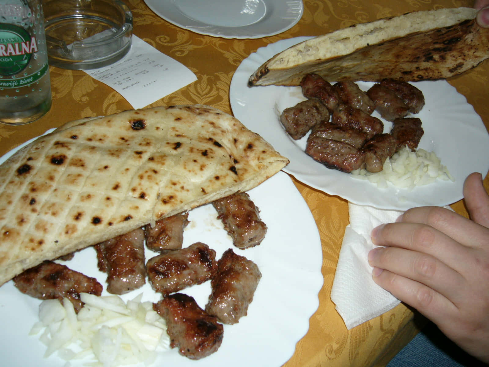 Pita Bread With Slices Of Ćevapi Sausages Background