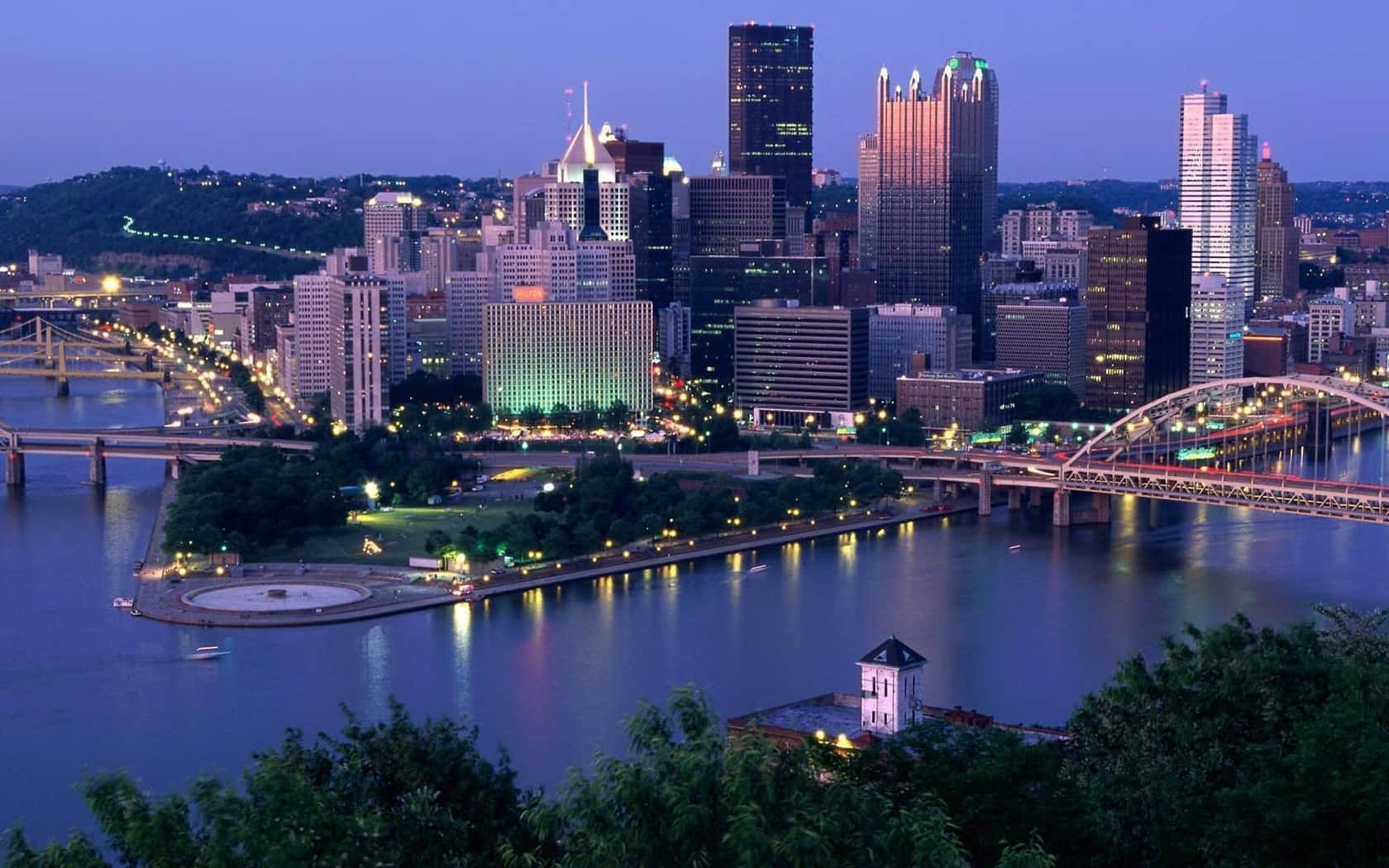 Pittsburgh Skyline River Intersection At Dusk Background