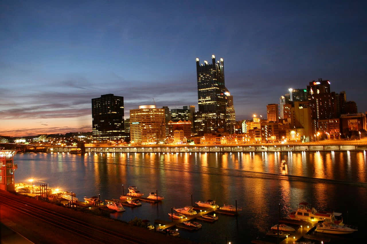 Pittsburgh Skyline With Boats Background