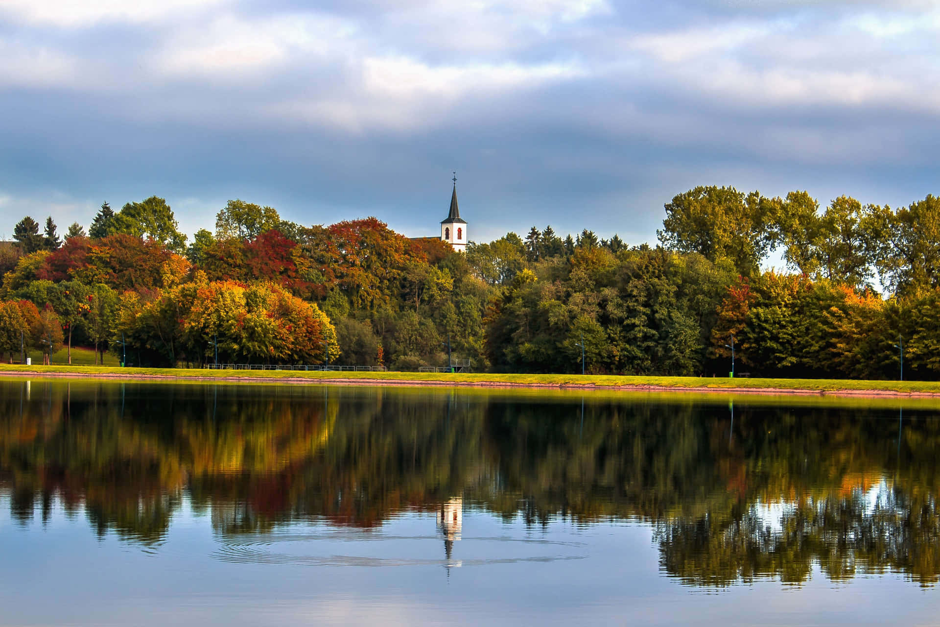 Placid Lake In The Autumn Background