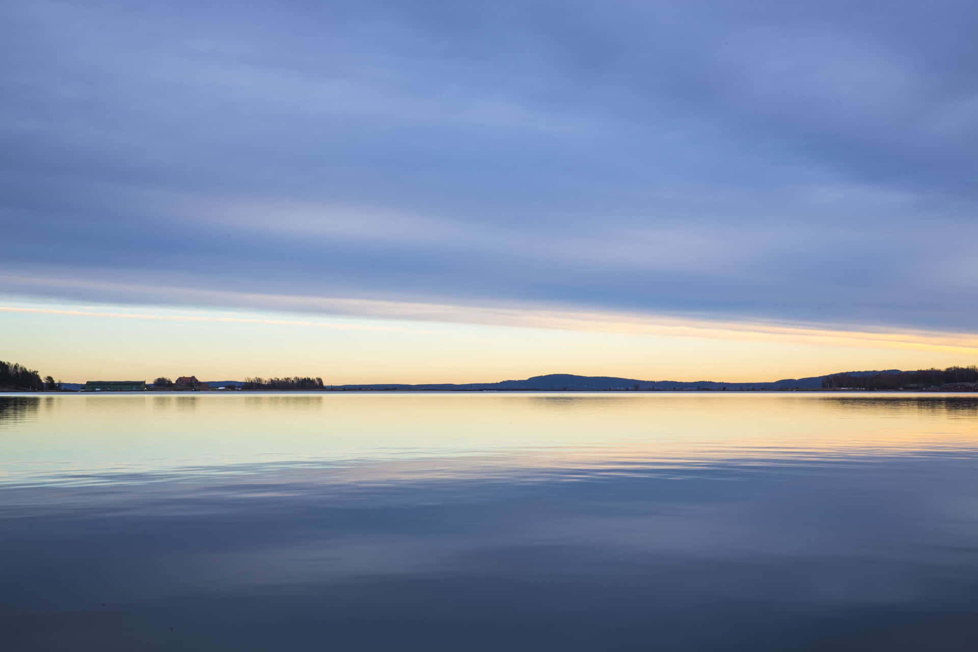Placid Lake On A Sunrise Background