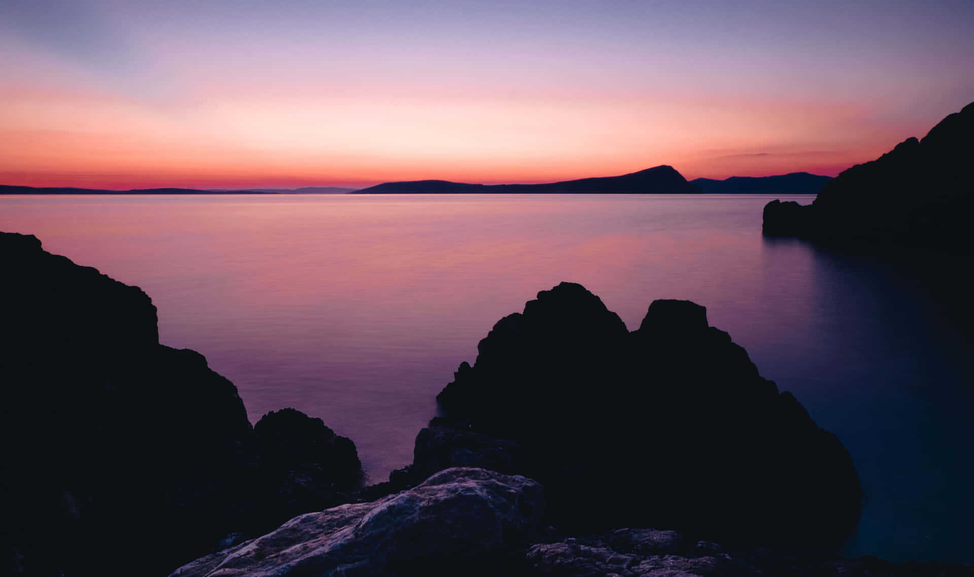 Placid Ocean On A Sunset Background
