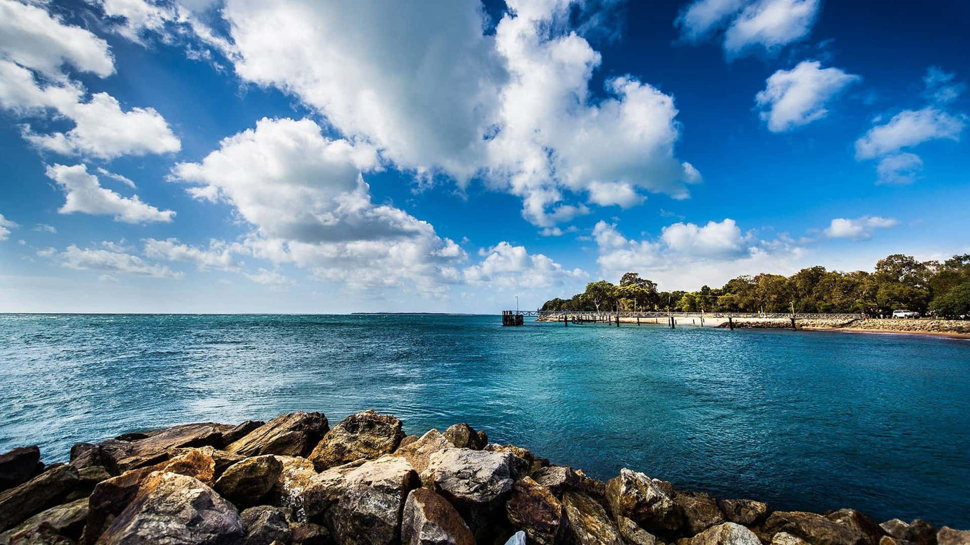 Placid Sky Above The Ocean Background