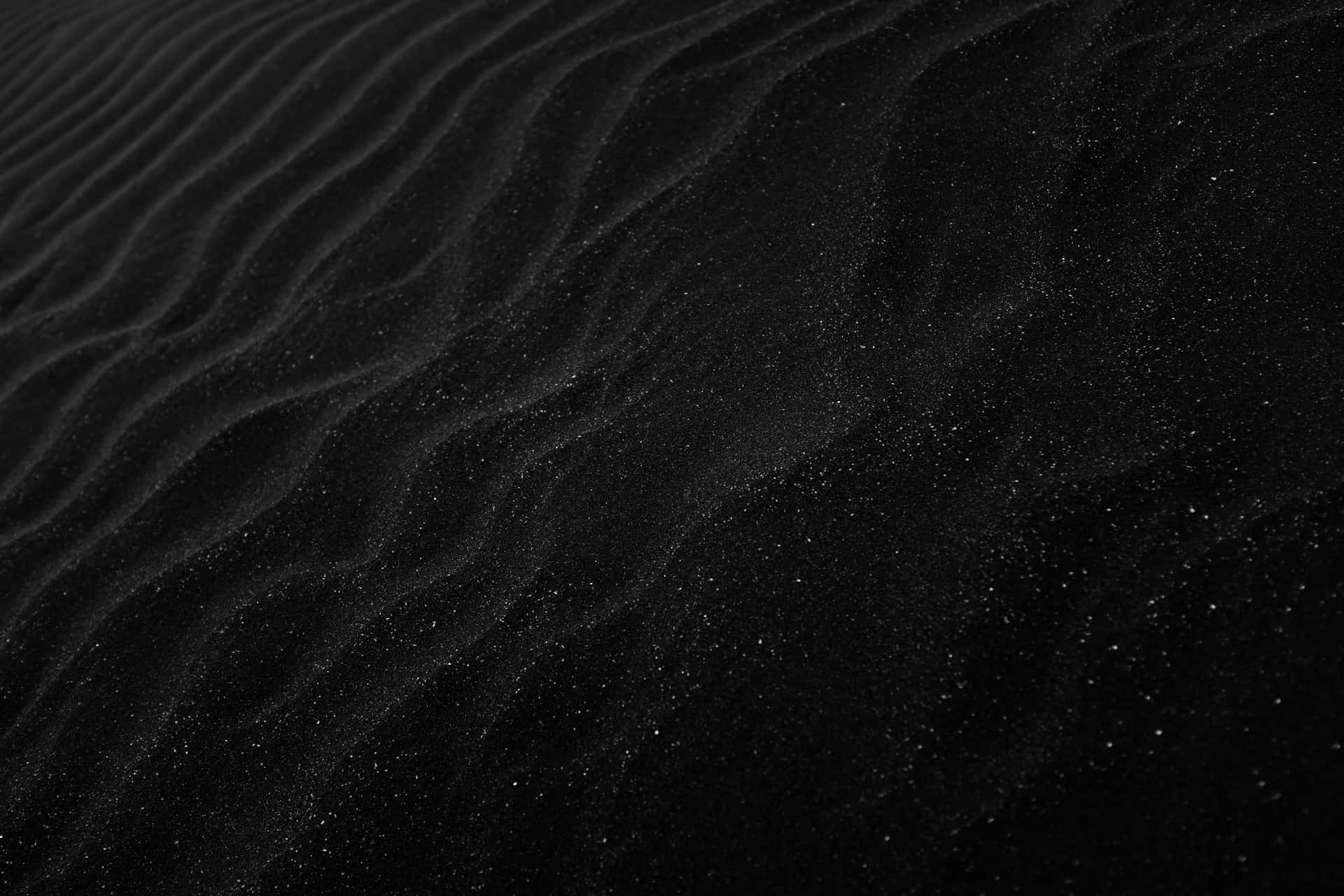 Plain Black Desktop With Sand Ridges Background