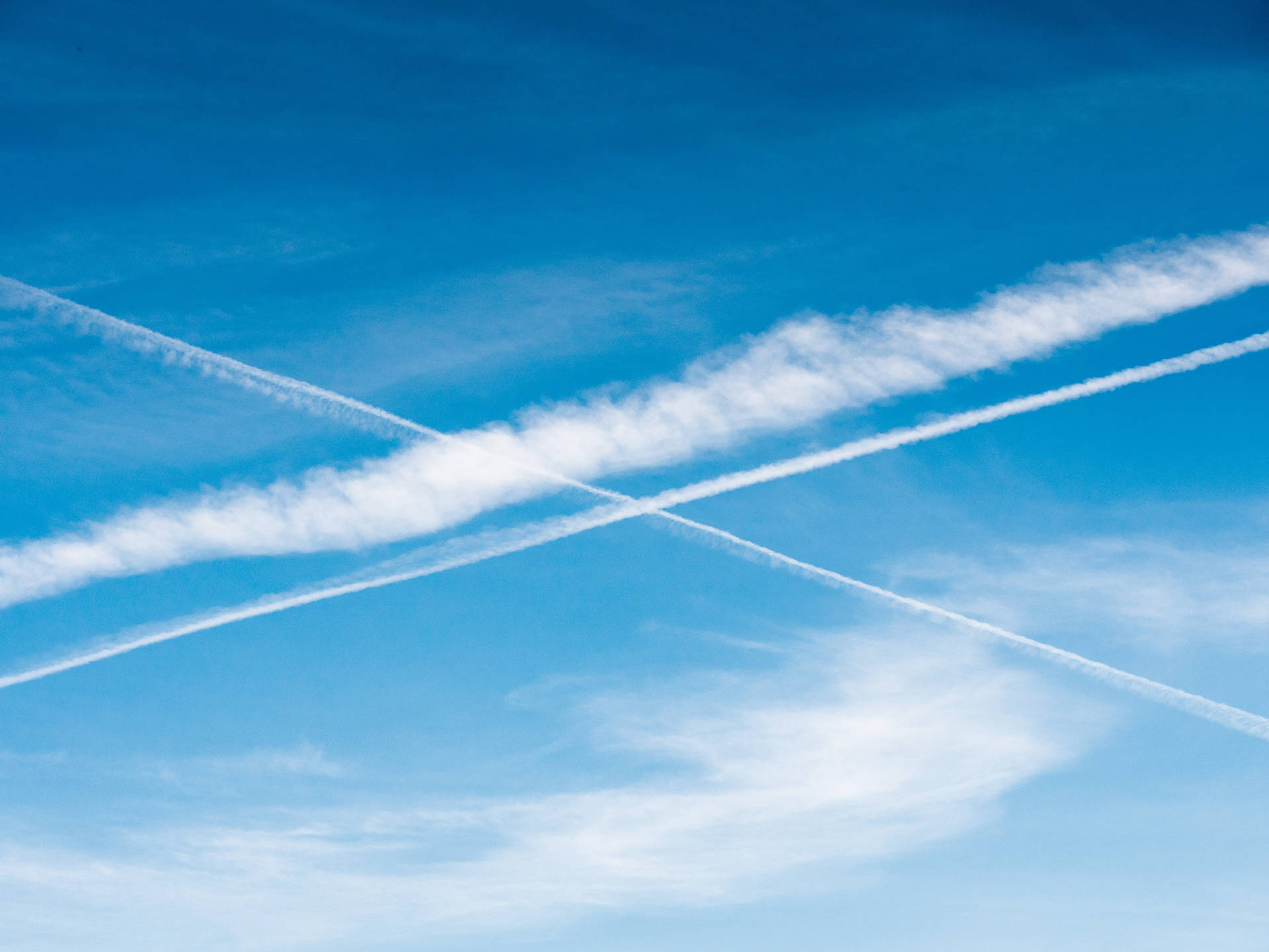 Plane Contrails In Azure Sky Background