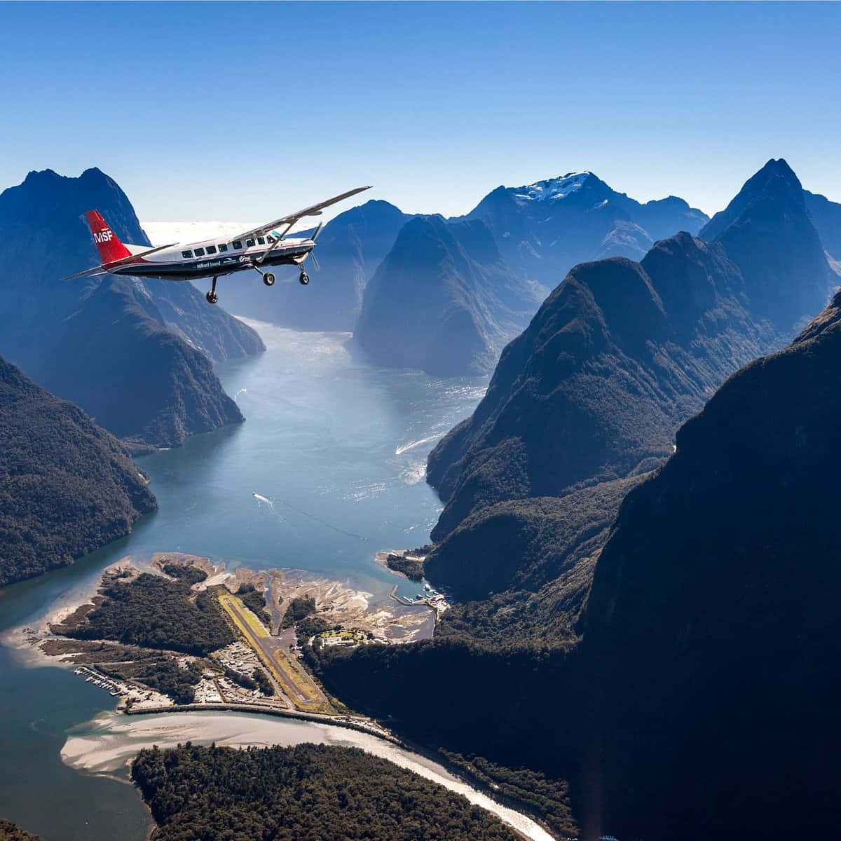 Plane Flying Over Milford Sound Background