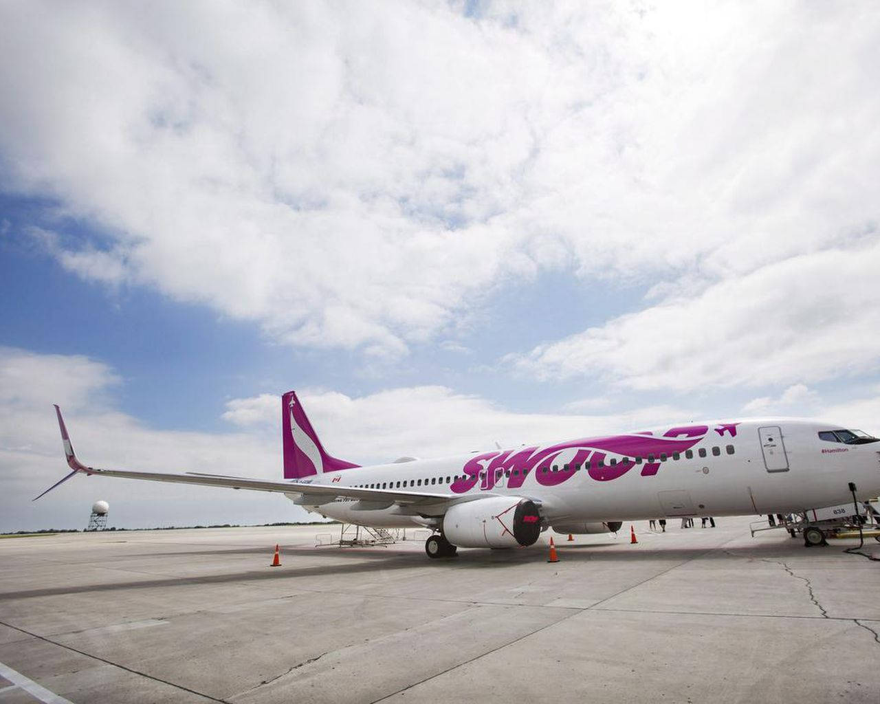 Plane Of Swoop Airlines At The Airport Background