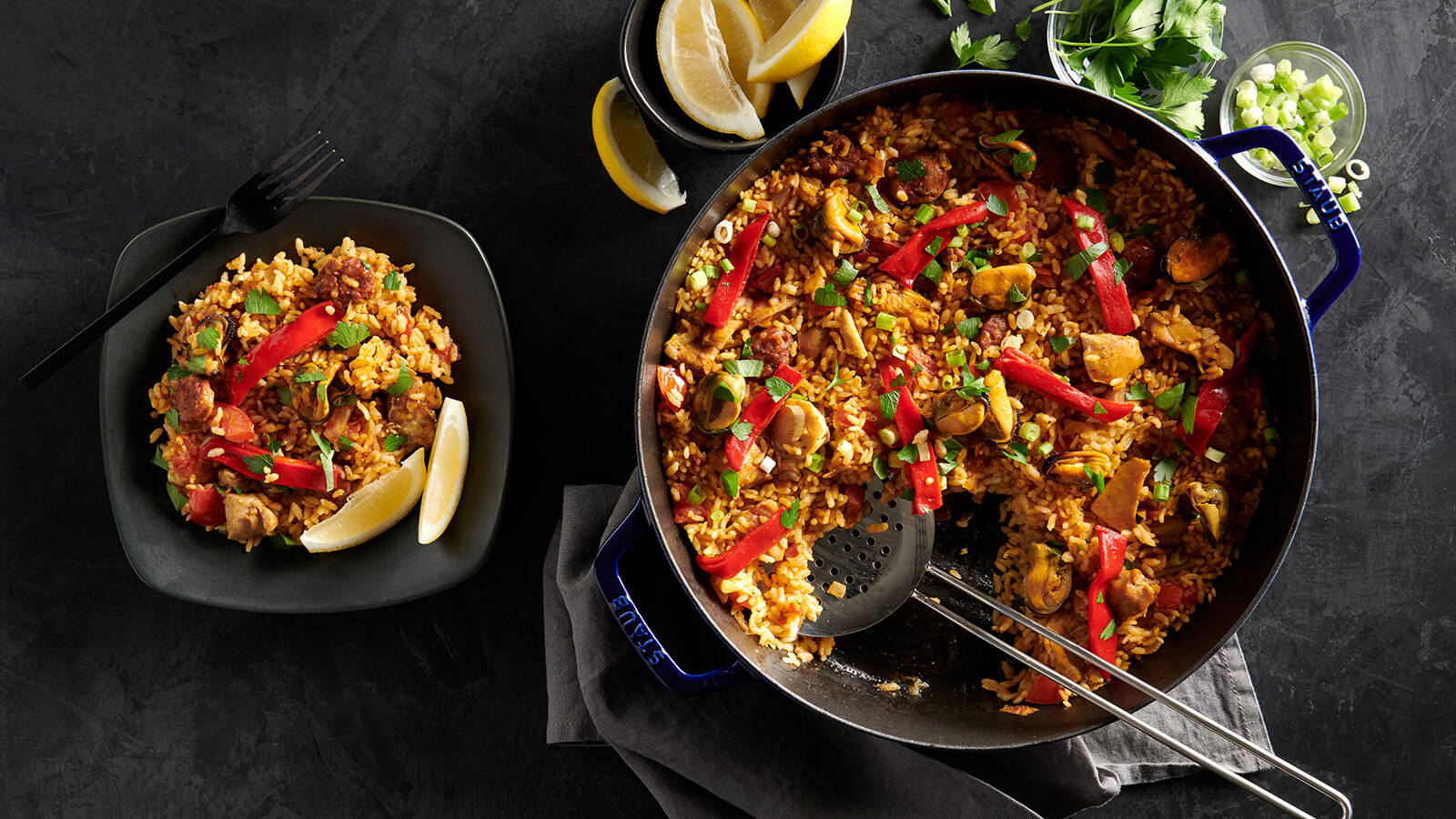 Plate And Pot Of Spicy Paella