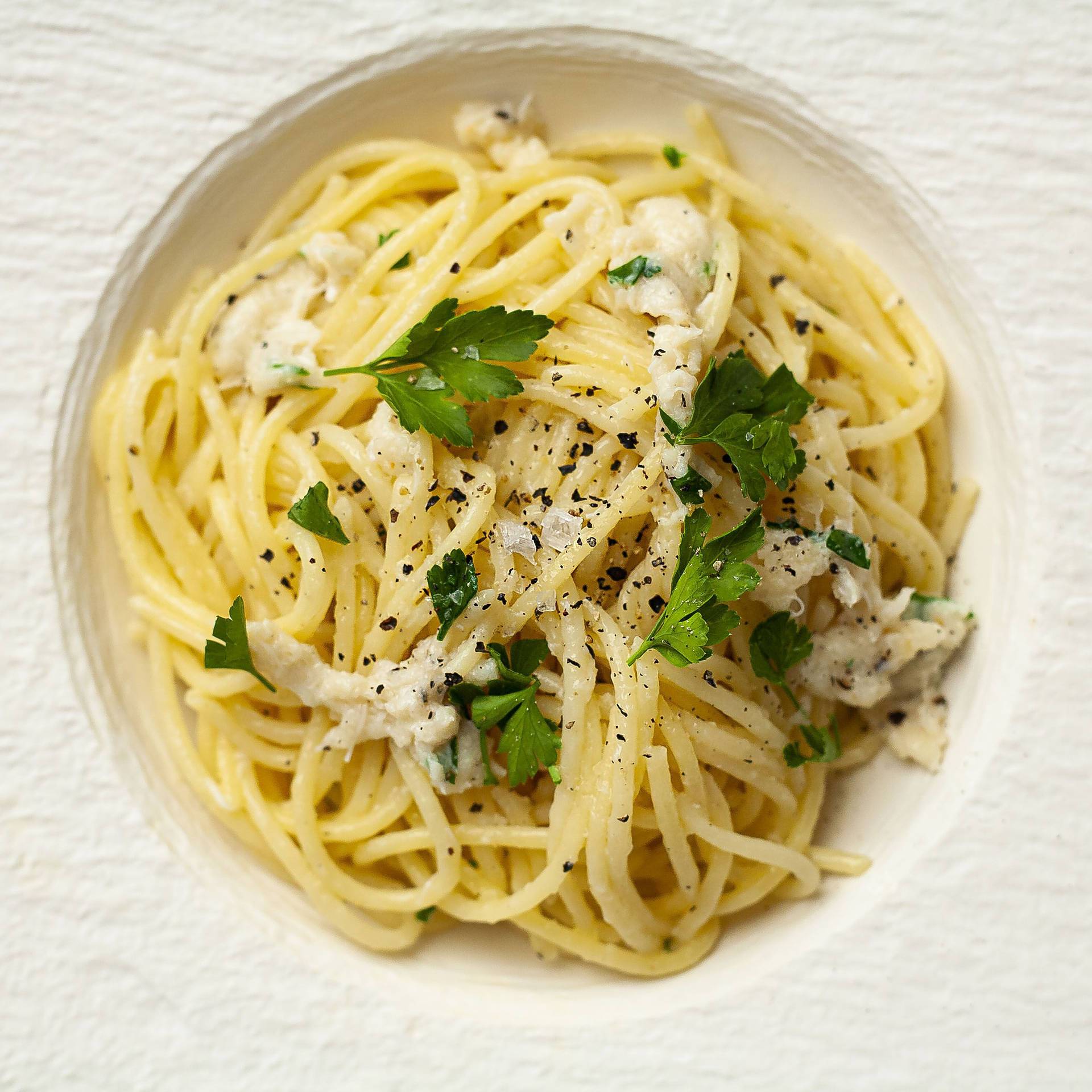 Plate Of Cacio E Pepe With Basil Background