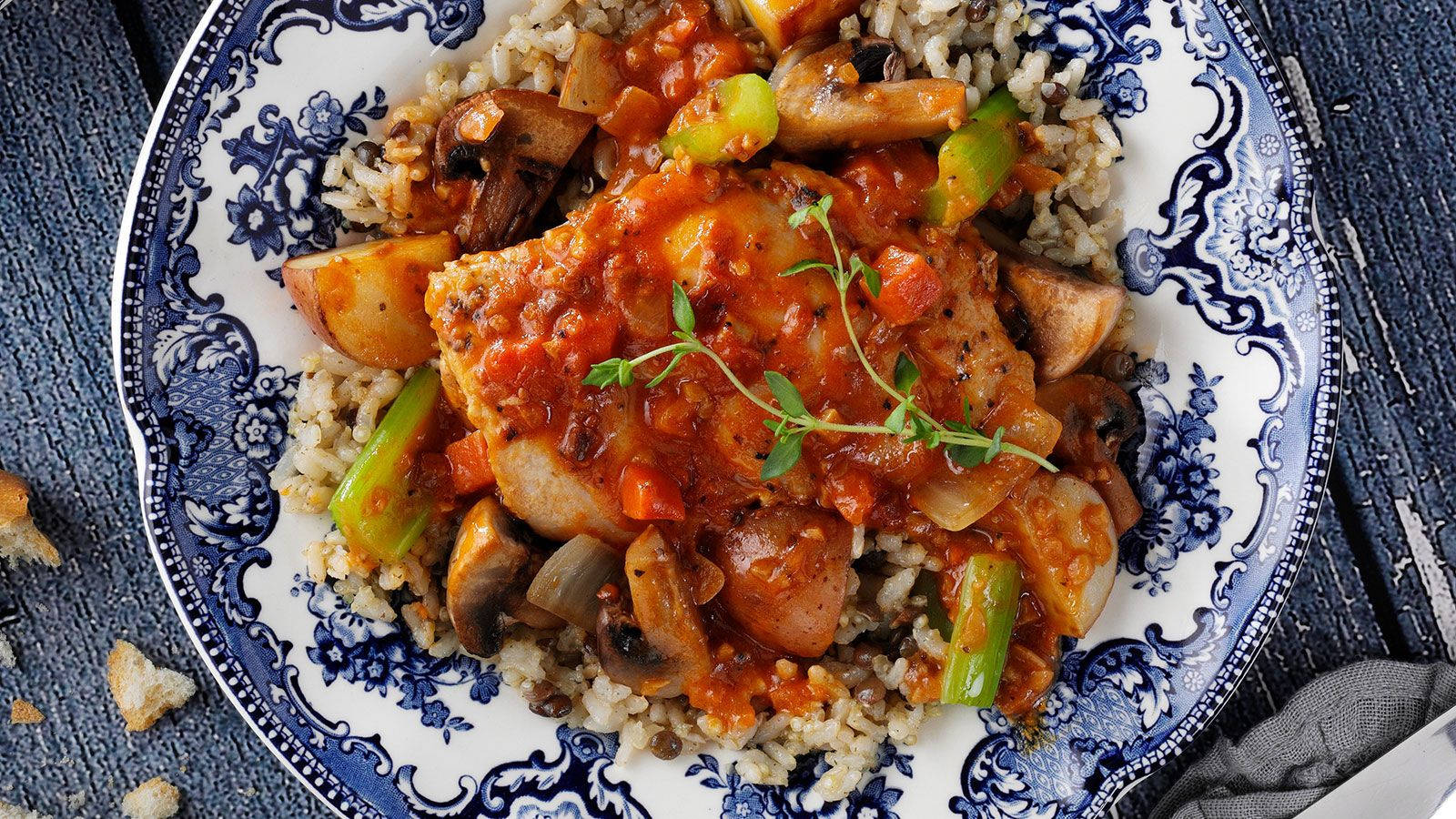 Plate Of Rice Topped With Coq Au Vin