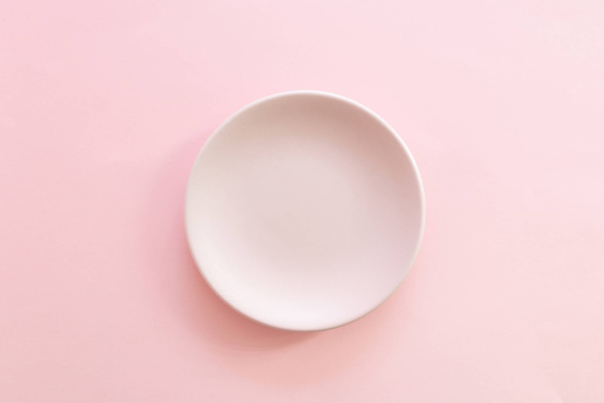 Plate On Pastel Pink Color Background