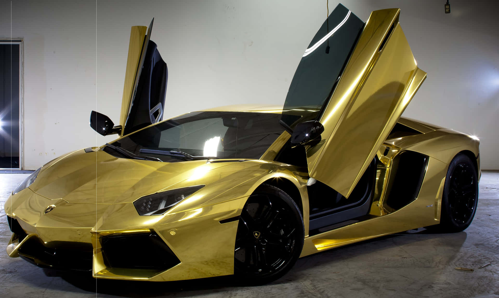 Plated Gold Lamborghini With Its Doors Open Background