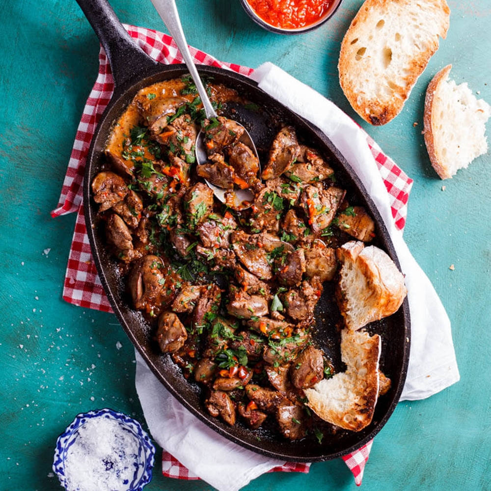 Platter Of Chicken Livers With Bread Background