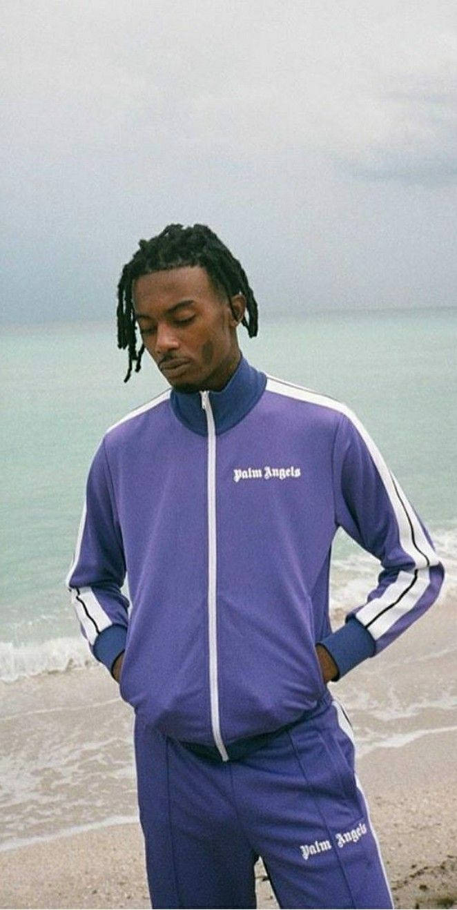 Playboi Carti Looking Stylish In Purple Tracksuit Background