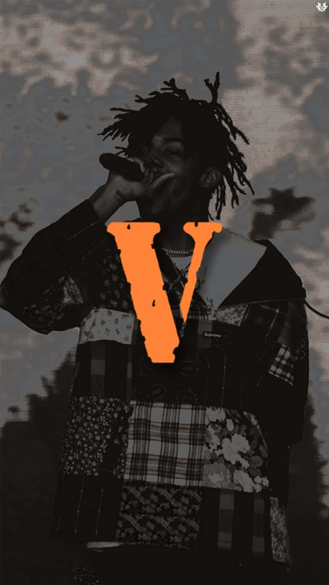 Playboi Carti Rocking His Signature Flower Crown And Pc Chains Background