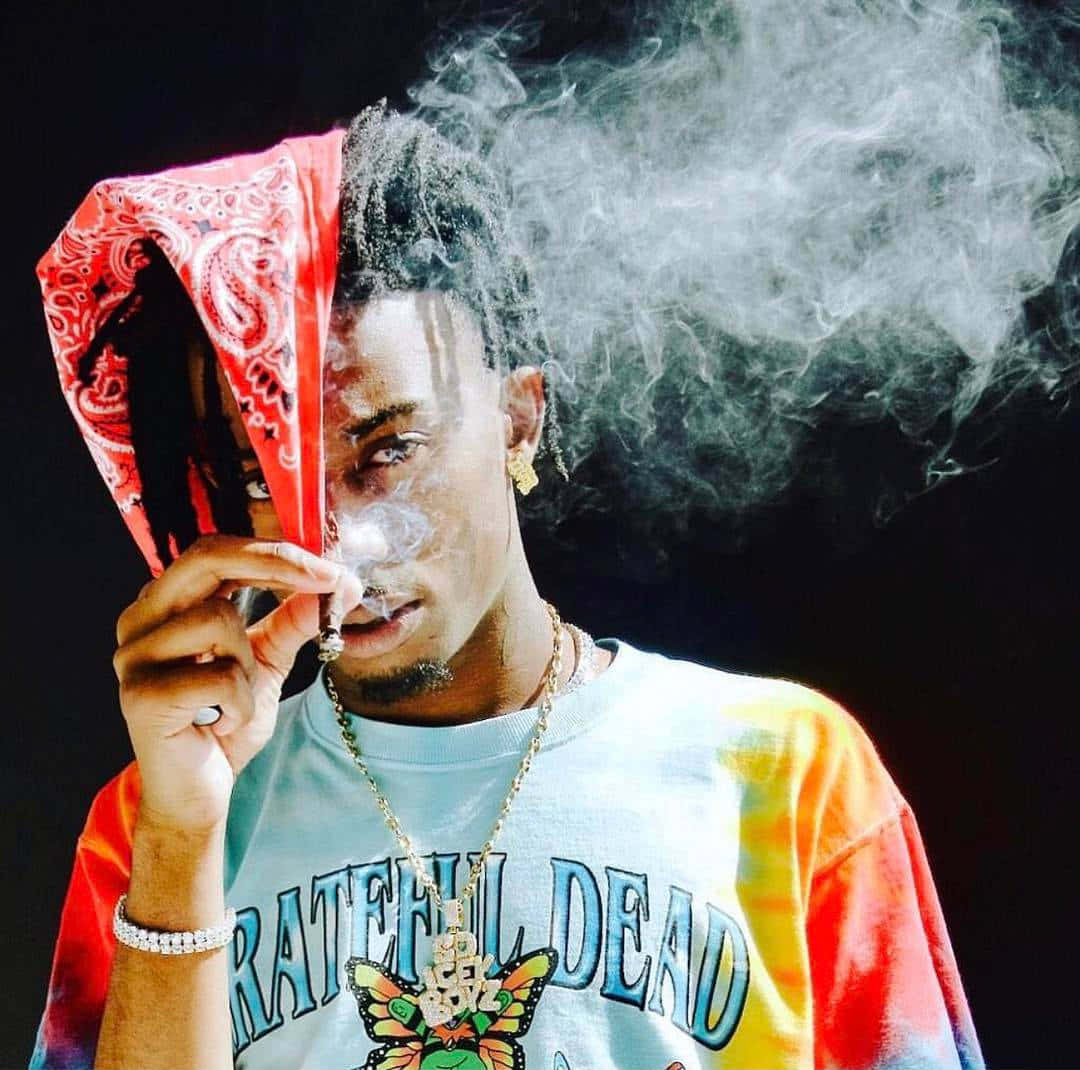 Playboi Carti Showcasing His Signature Style Background