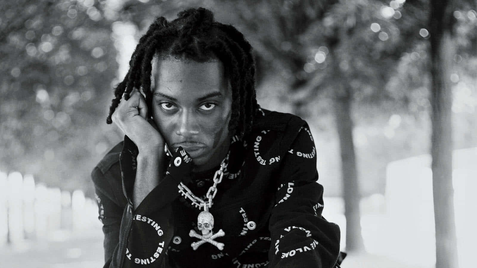 Playboi Carti Wearing His Signature Style Of Colorful Fashion Background
