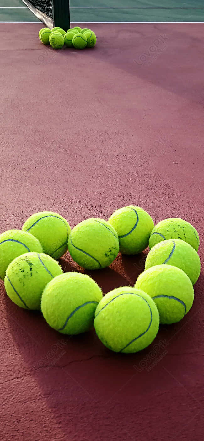 Players Hitting That Sweet Spot With A Brand New Tennis Ball. Background