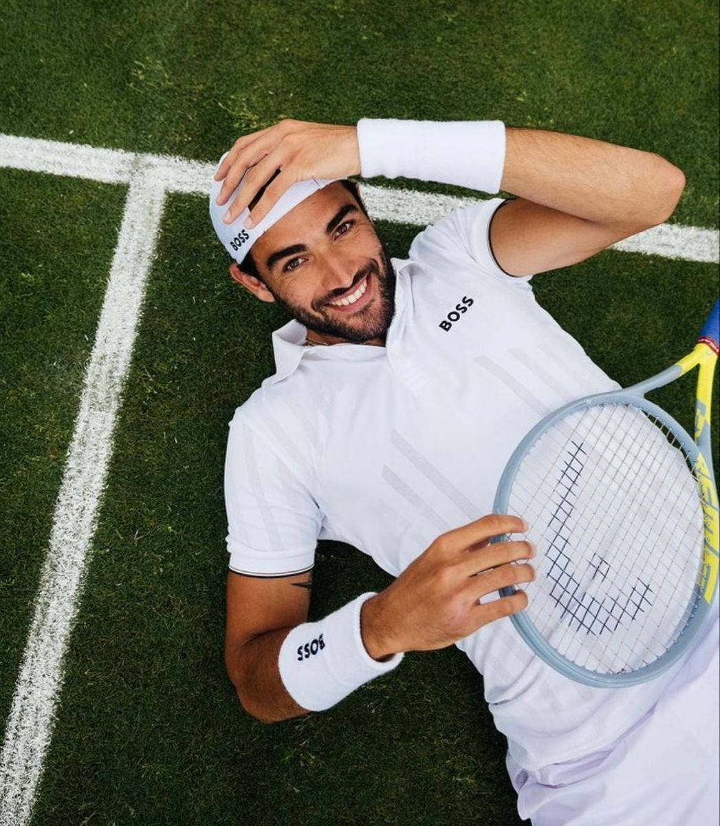 Playful Matteo Berrettini Top View Background