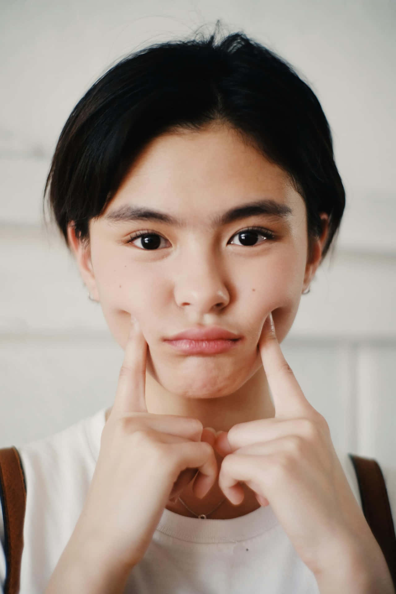 Playful Smile Forced Cheeks Portrait Background